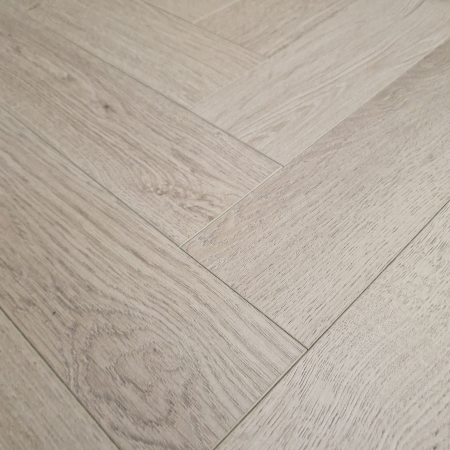 Kingsley 8mm Ashford Oak Herringbone Laminate Flooring