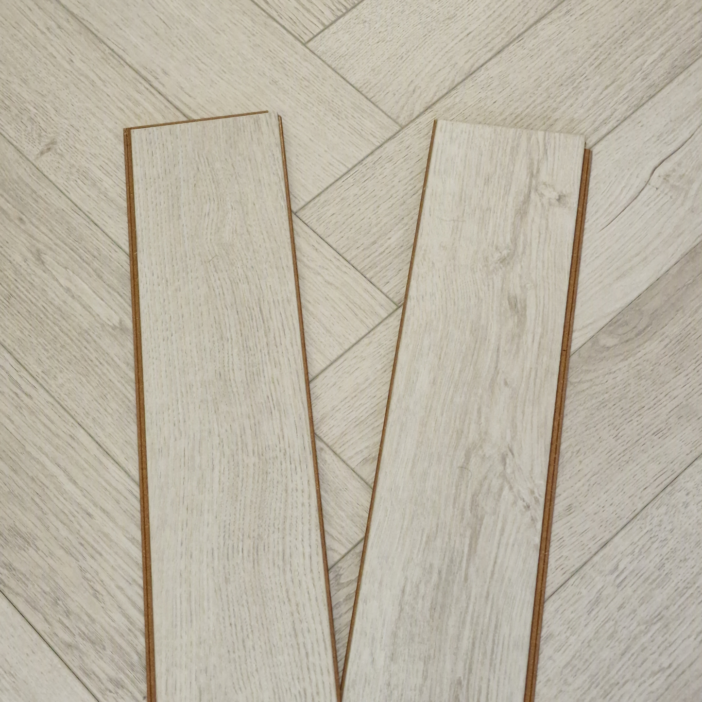 Kingsley 8mm Ashford Oak Herringbone Laminate Flooring
