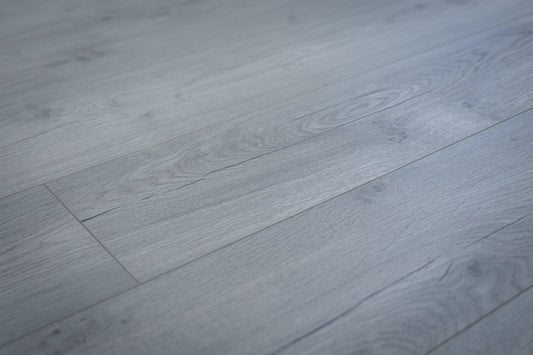 Close-up of gray wooden flooring with a focus on texture and pattern.