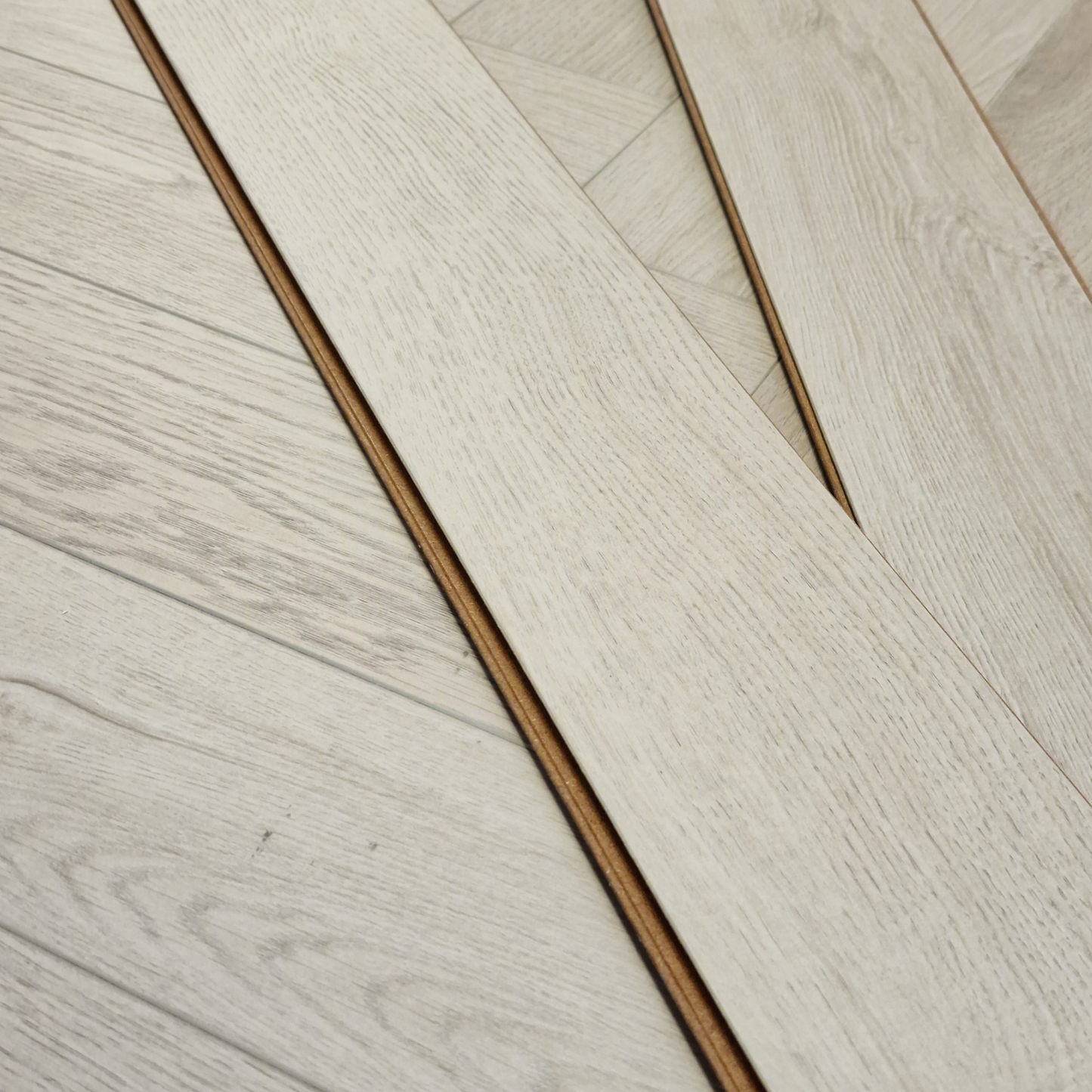 Kingsley 8mm Ashford Oak Herringbone Laminate Flooring