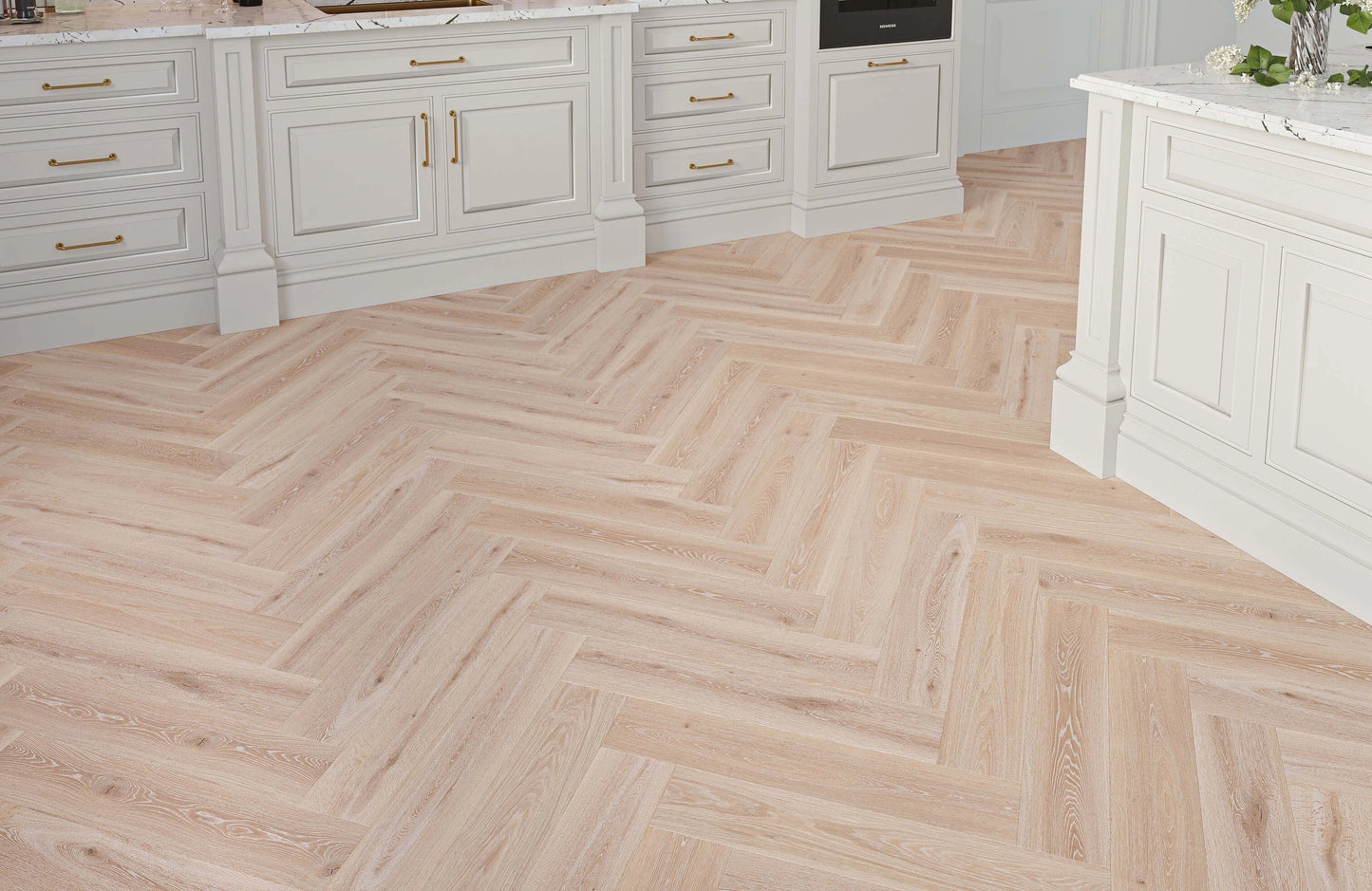 Wooden floor with herringbone pattern in a kitchen setting
